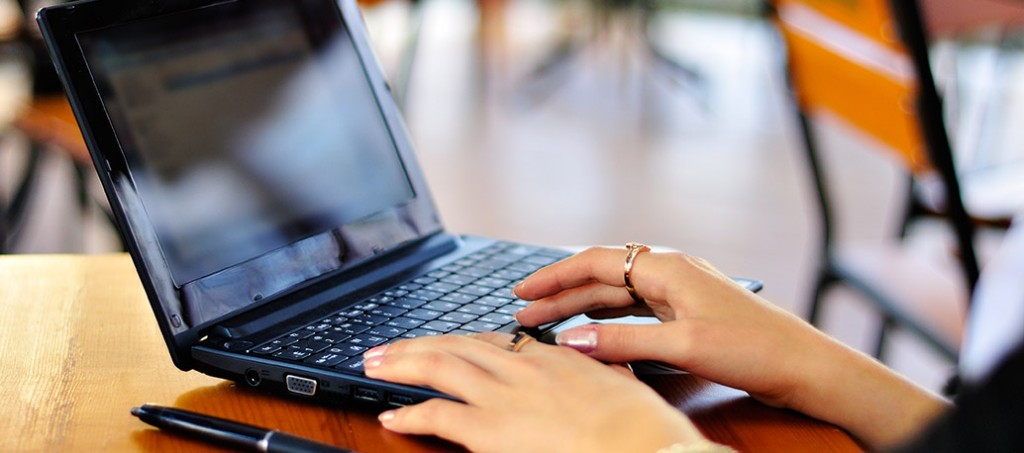 Photo of a laptop and some hands